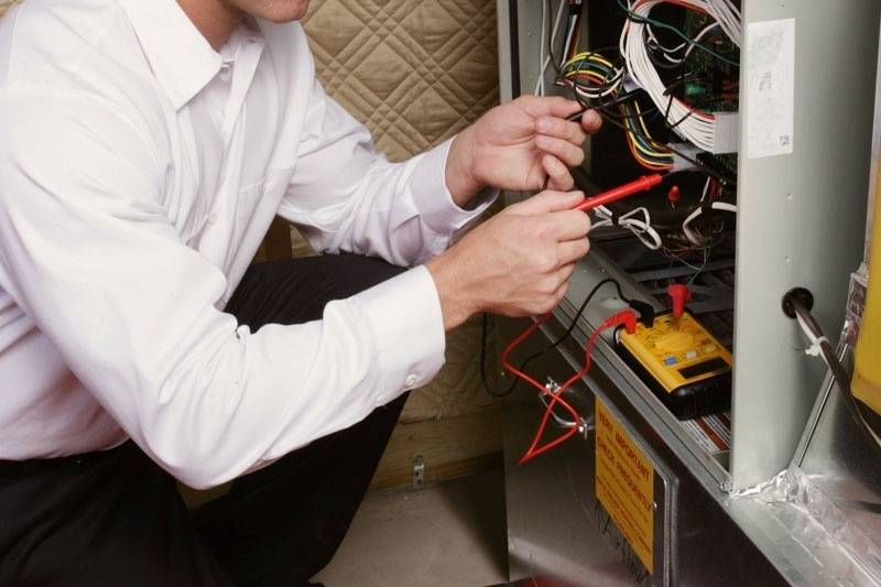 HVAC technician working on a furnace