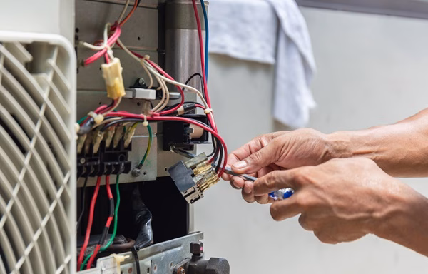 Close,Up,Of,Air,Conditioning,Repair,,Repairman,Installing,Magnetic,Contactor