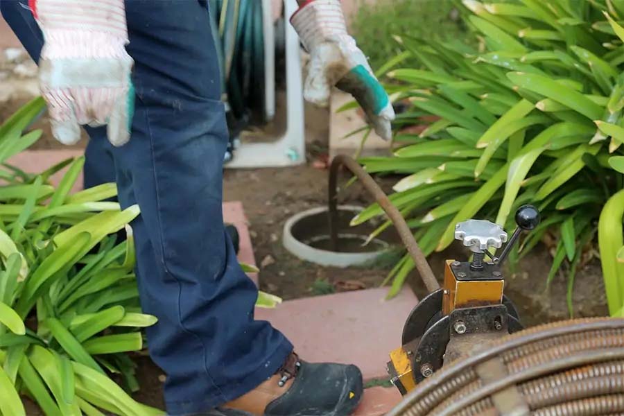 Drain cleaning in progress